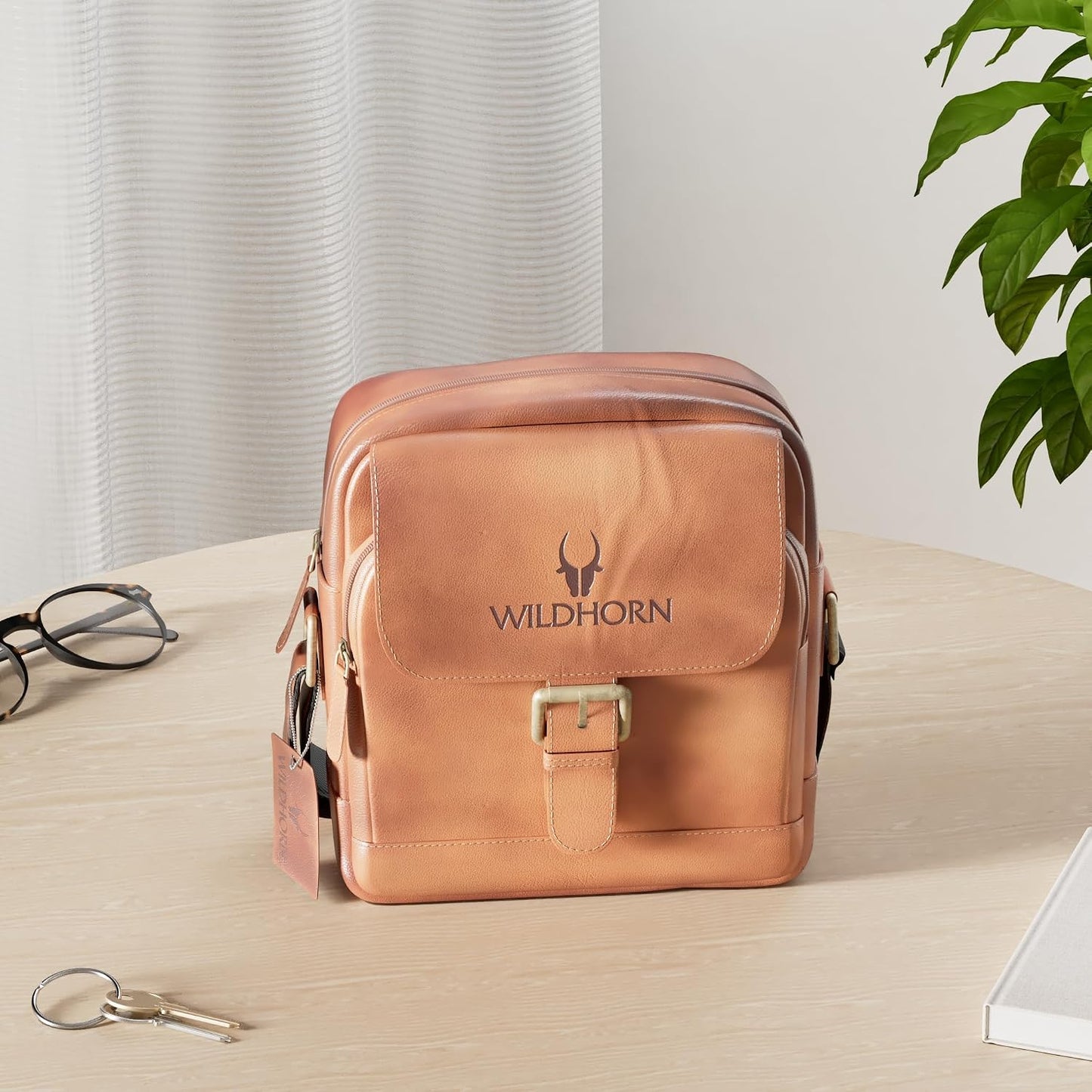 WildHorn genuine leather mini sling bag men tan vintage lifestyle shot side angle — bags.mu Mauritius