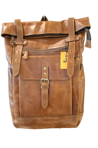 bags.mu exclusive cognac tan full grain leather roll-top backpack front view with brass buckle and zip pockets — bags.mu Mauritius