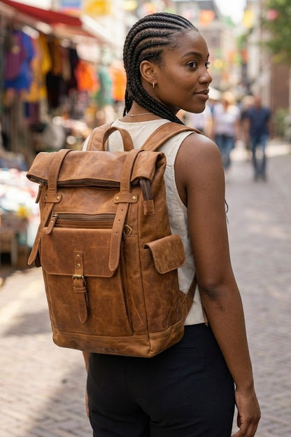 bags.mu exclusive large genuine leather roll-top backpack front angle view showing rich cognac patina and brass hardware — bags.mu Mauritius