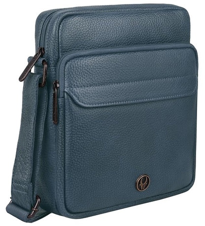 A blue pebbled leather crossbody bag with a front zippered pocket and a small circular metal logo badge, shown on a plain white background.