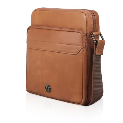 A brown leather crossbody laptop bag with a front slip pocket, a top zip closure, and an adjustable shoulder strap, shown on a white background with a soft reflection.