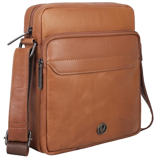 A brown leather crossbody bag with a front zippered pocket, side zipper, and adjustable shoulder strap, shown on a plain white background.