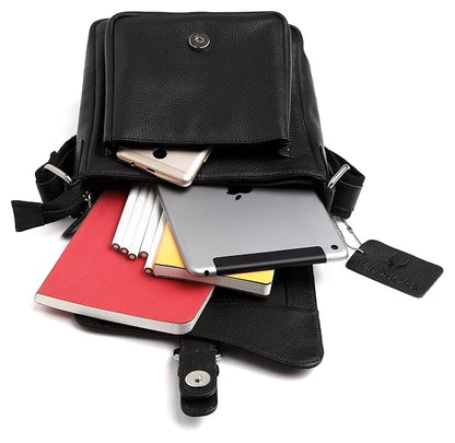 Black leather crossbody bag with various items including a tablet, phone, and books on a white background