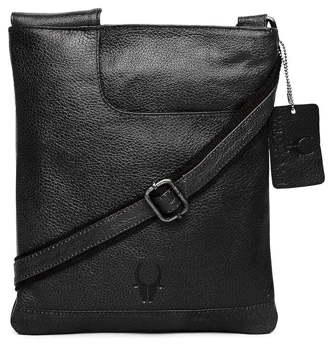 Black textured leather crossbody bag with a diagonal strap, a hanging brand tag, and a debossed logo on the front, shown on a white background.