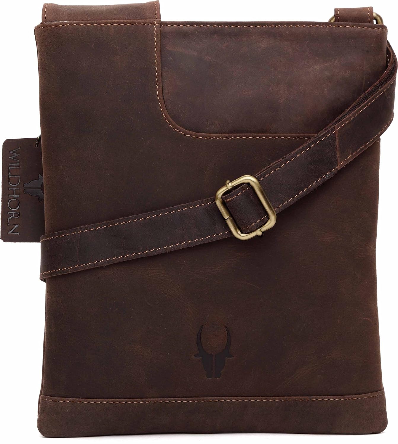 A dark brown distressed leather crossbody bag with a matching leather strap and a gold-tone buckle, featuring a debossed bull skull logo on the front.