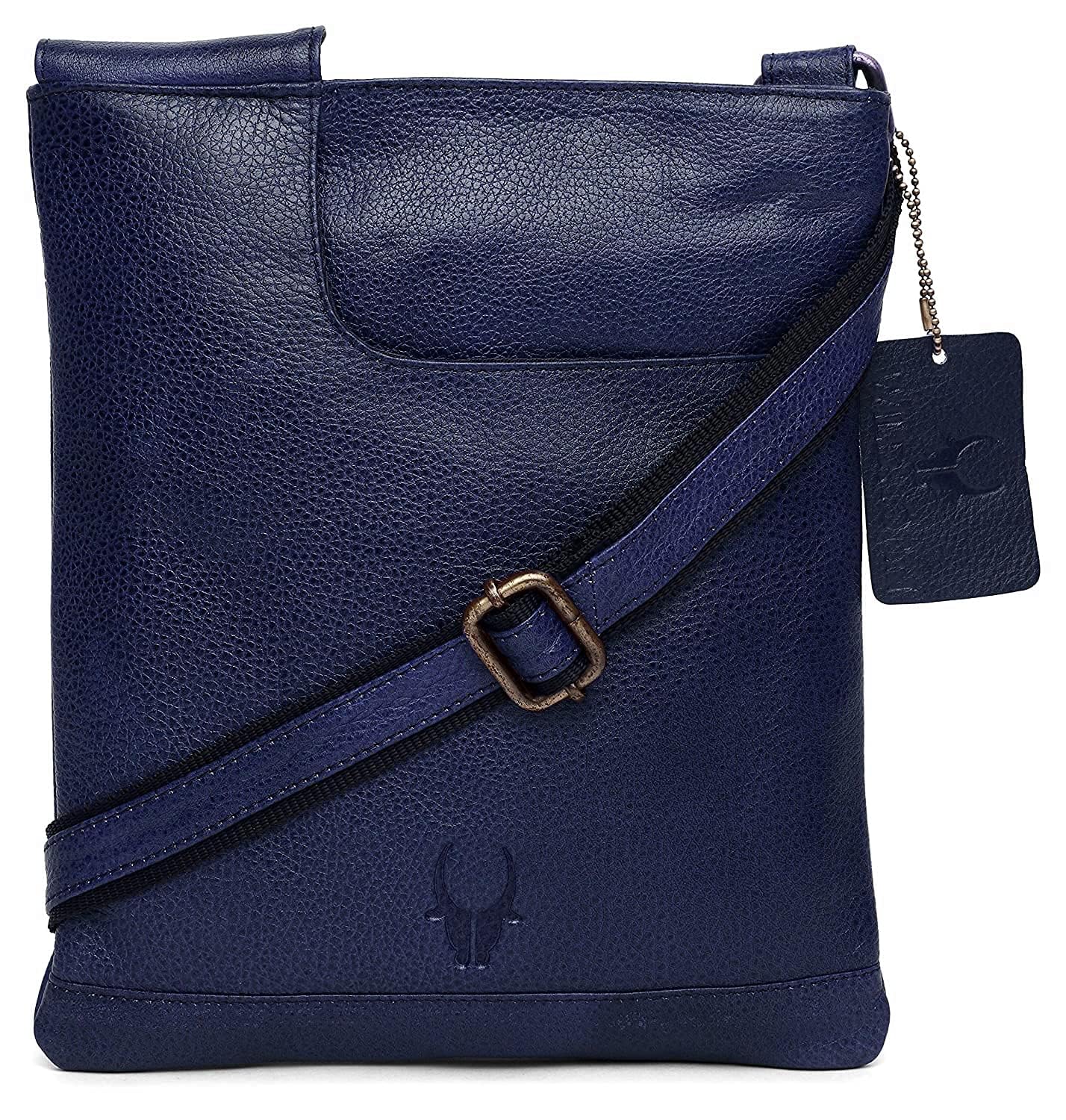 A navy blue textured leather crossbody bag with a matching adjustable strap and a hanging brand tag, shown on a plain white background.