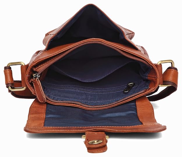 Open brown leather shoulder bag showing the navy blue interior lining, zipper compartments, and gold-tone hardware on a white background.