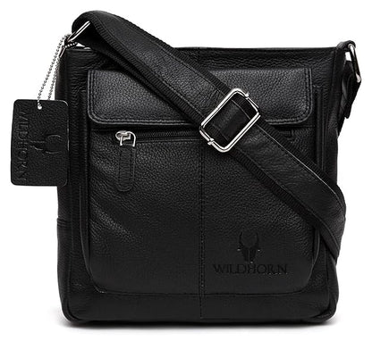 Black pebbled leather crossbody bag with a front flap pocket, silver buckle strap, and embossed WILDHORN logo on a white background.