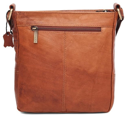 A brown leather crossbody bag with a front zippered pocket, featuring a vertical stitched seam and a small metal brand tag that reads 'Wildhorn'.