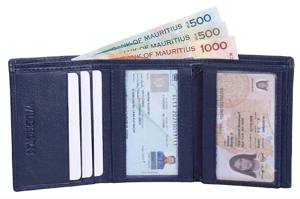 A dark navy blue leather bi-fold wallet shown open, containing credit cards, identification documents, and three Bank of Mauritius 500 and 1000 Mauritian Rupee banknotes. The brand name 'Wildhorn' is embossed on the left pocket.
