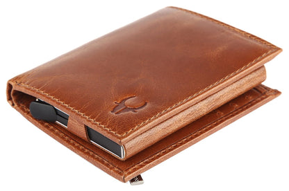 A brown leather card holder wallet with a minimalist design, featuring a debossed Wildhorn logo on the front, a zippered closure, and a black card slot visible on the side, set against a plain white background Bags.mu