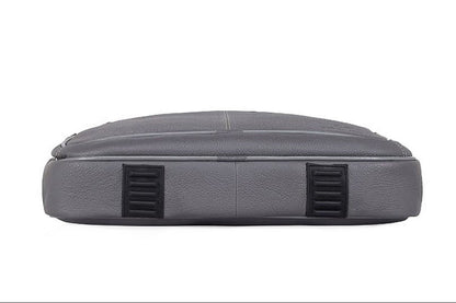 WildHorn grey leather messenger bag twin grab handles and bronze zipper hardware detail — bags.mu Mauritius